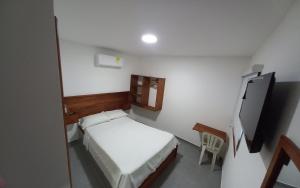 Postel nebo postele na pokoji v ubytování HOTEL SAN ADOLFO