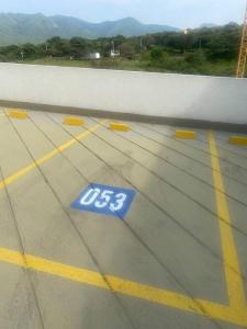 a blue sign on the floor of a building at Greece In Home in Girardot