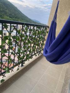 a couple of blue hammocks on a balcony at Greece In Home in Girardot