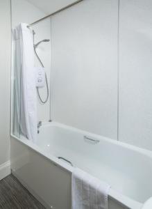 a bathroom with a large mirror and a sink at Taigh Carnan - 2 Huntly Terrace in Inverness