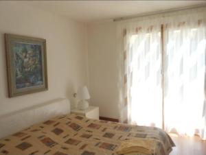 Ένα ή περισσότερα κρεβάτια σε δωμάτιο στο Portopiccolo Cuore Dolce by Avolare