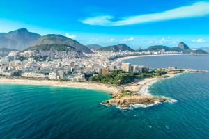 an aerial view of a city and the ocean at Rio Design Copacabana Hotel in Rio de Janeiro