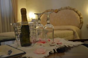 a table with two wine bottles on top of it at Hotel Santa Lucia in Minori