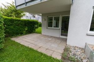 a patio in front of a house at Appartment am Ziegelwasen in Kirchheim unter Teck