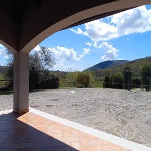 an open patio with a view of a mountain at Tenuta Armida Relax & Pool in Liberi