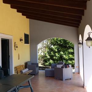 a living room with a couch and a table at Tenuta Armida Relax & Pool in Liberi +52 photos