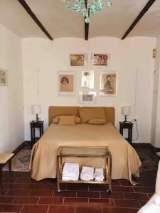 a bedroom with a large bed with towels on it at Il Giardorto in Casalini