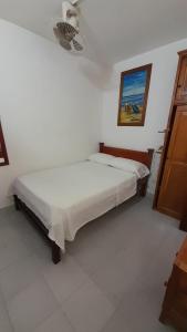 Postel nebo postele na pokoji v ubytování HOTEL SAN ADOLFO