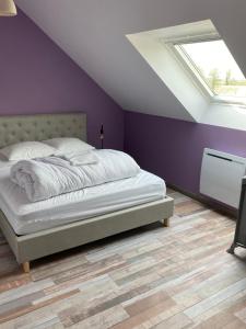 Postel nebo postele na pokoji v ubytování La Margotine