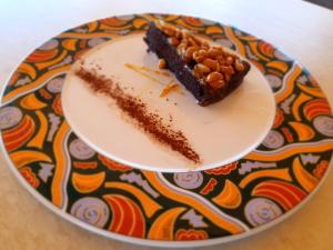 a piece of cake on a plate on a table at Antica Pensione Pinna in Castelsardo
