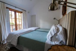 Scratch House Hotel Boutique客房内的一张或多张床位