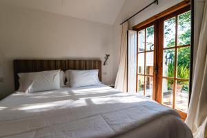 Scratch House Hotel Boutique客房内的一张或多张床位
