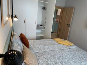 a small bedroom with a bed in a room at Dream_Apartment in Varna City