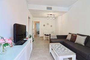 TV a/nebo společenská místnost v ubytování Apartamento San Leonardo Playa (Free Parking)