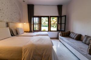 Scratch House Hotel Boutique客房内的一张或多张床位