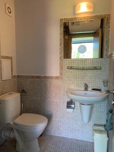 a bathroom with a toilet and a sink at Studio for4 Sunny Beach in Sunny Beach