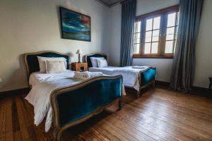 Scratch House Hotel Boutique客房内的一张或多张床位