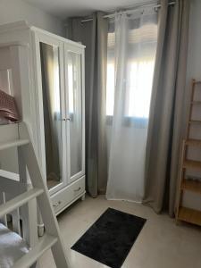 Postel nebo postele na pokoji v ubytování Apartamento Turístico Julia Gemella Acci