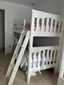 Postel nebo postele na pokoji v ubytování Apartamento Turístico Julia Gemella Acci
