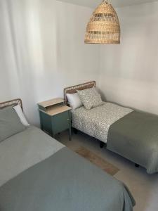 Postel nebo postele na pokoji v ubytování Apartamento Turístico Julia Gemella Acci