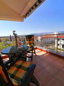 a patio with a table and chairs on a balcony at Apartment Franka in Sveti Vid-Miholjice