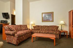 a living room with a couch and a coffee table at Studio 6 - Minot, ND in Minot
