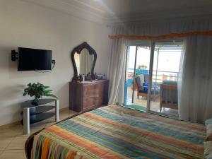 Una cama o camas en una habitación de Grand appart avec vue sur mer