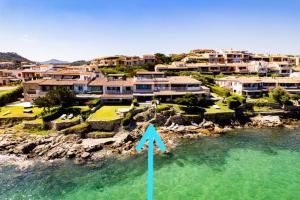 an aerial view of a resort with a blue arrow at House On The Sea Porto Rotondo in Porto Rotondo