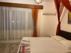 Кровать или кровати в номере Bonjourla Otel