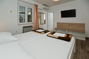 Postel nebo postele na pokoji v ubytování Guesthouse Aurora