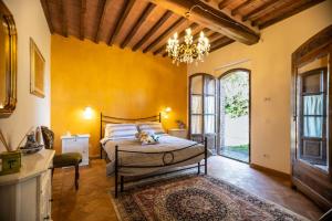 Postel nebo postele na pokoji v ubytování Agriturismo Val di Tufo