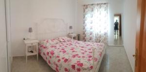 Łóżko lub łóżka w pokoju w obiekcie Casita Beach Front