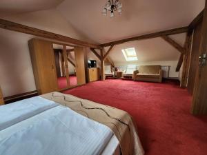 a bedroom with a bed and a living room at Antique ApartHotel in Alba Iulia