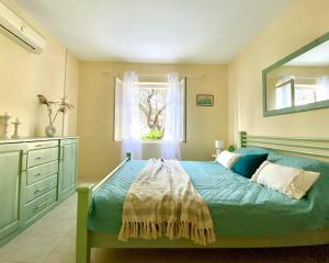 a bedroom with a bed and a window at Sea view country house in Prčanj