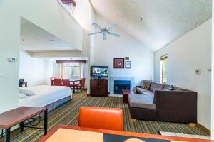 a hotel room with a bed and a couch at Metro Phoenix Loft sleeps 6 in Phoenix