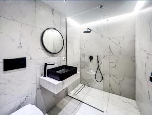 a bathroom with a black sink and a mirror at Caruso 1 - Sorrento in Sorrento