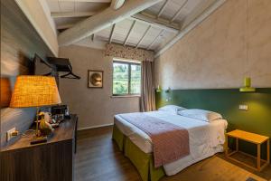 Voodi või voodid majutusasutuse Relais Le Coste toas