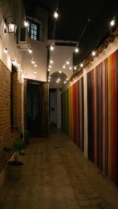 an empty hallway with colorful walls and lights at Casa Yuri in Salta