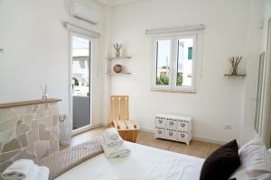 Postel nebo postele na pokoji v ubytování Il Colibrì - VILLA a POCHI PASSI dal MARE