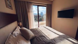 מיטה או מיטות בחדר ב-Luxury Dreamland Oasis Apartments