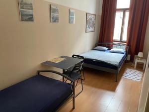 Postel nebo postele na pokoji v ubytování Hostel EMMA