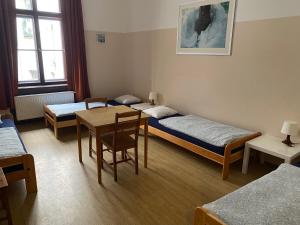 Postel nebo postele na pokoji v ubytování Hostel EMMA