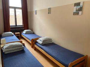 Postel nebo postele na pokoji v ubytování Hostel EMMA