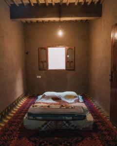 Giường trong phòng chung tại Dar Nuyum