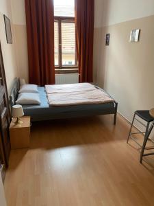Postel nebo postele na pokoji v ubytování Hostel EMMA