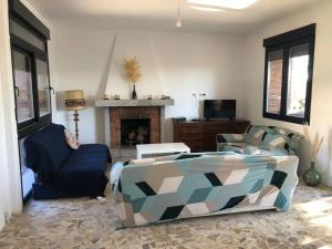 Posezení v ubytování Villa Rana, con amplio jardín, barbacoa y piscina + 28 fotografií