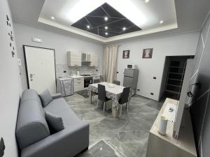 a living room with a couch and a table at Dream House in Catania