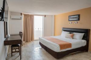 Postel nebo postele na pokoji v ubytování Hotel Calypso Cancun