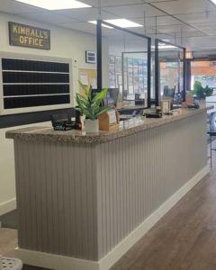 an office with a reception counter with computers on it at Kimball Terrace Inn in Northeast Harbor +16 photos