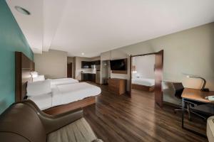 a hotel room with a bed and a desk at Best Western Bowie Inn & Suites in Bowie +27 photos